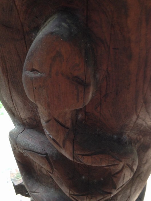 eastern diamondback rattlesnake helping to support totem hall...